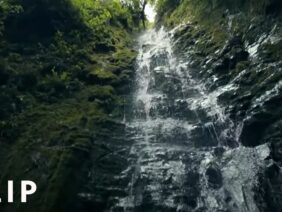 Albert Lin climbs up a treacherous waterfall in search of ancient tombs
